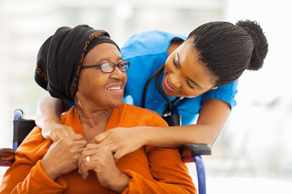 Respite caregiver spending time with a senior client at home